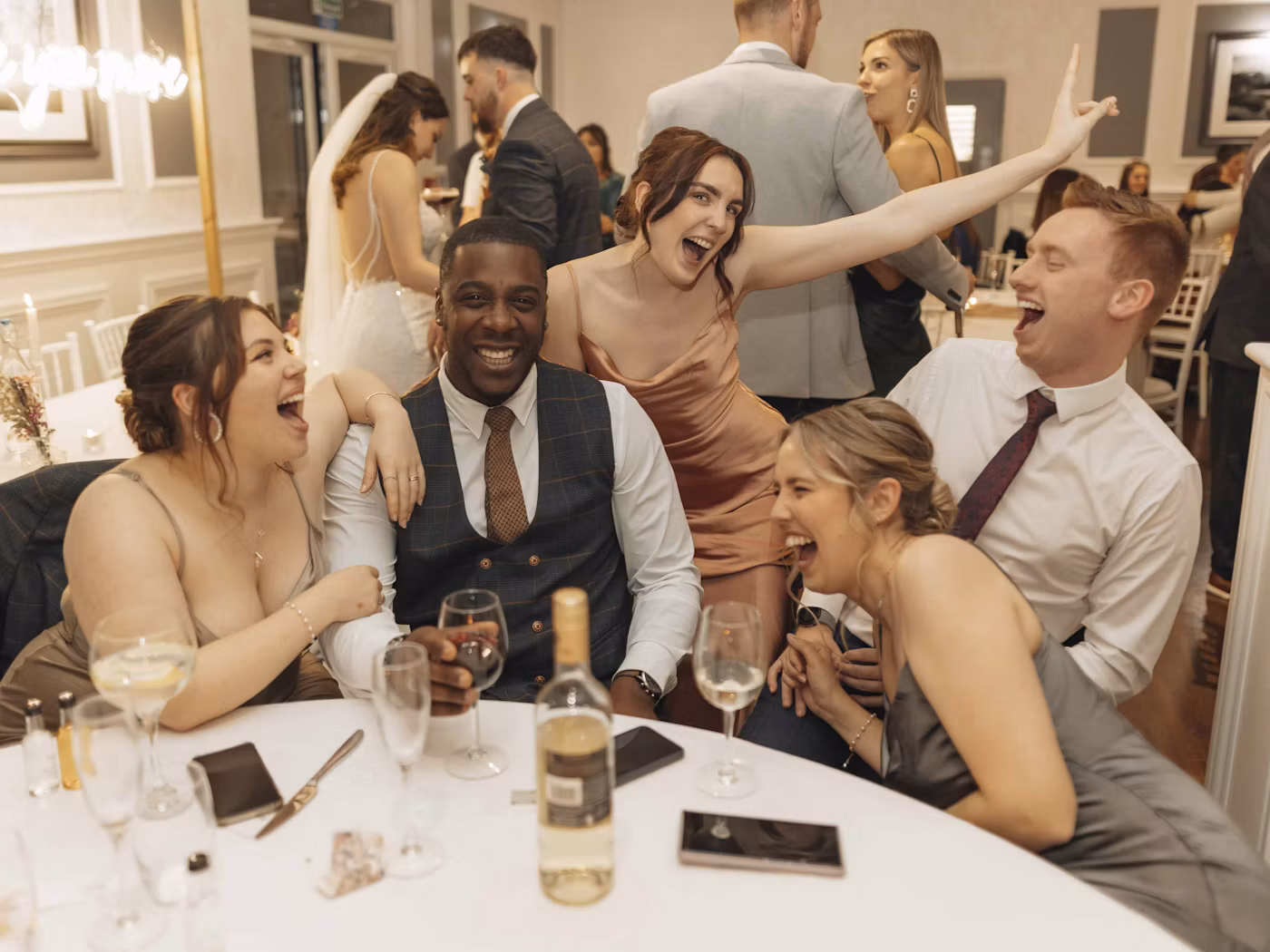 Wedding guests laughing together