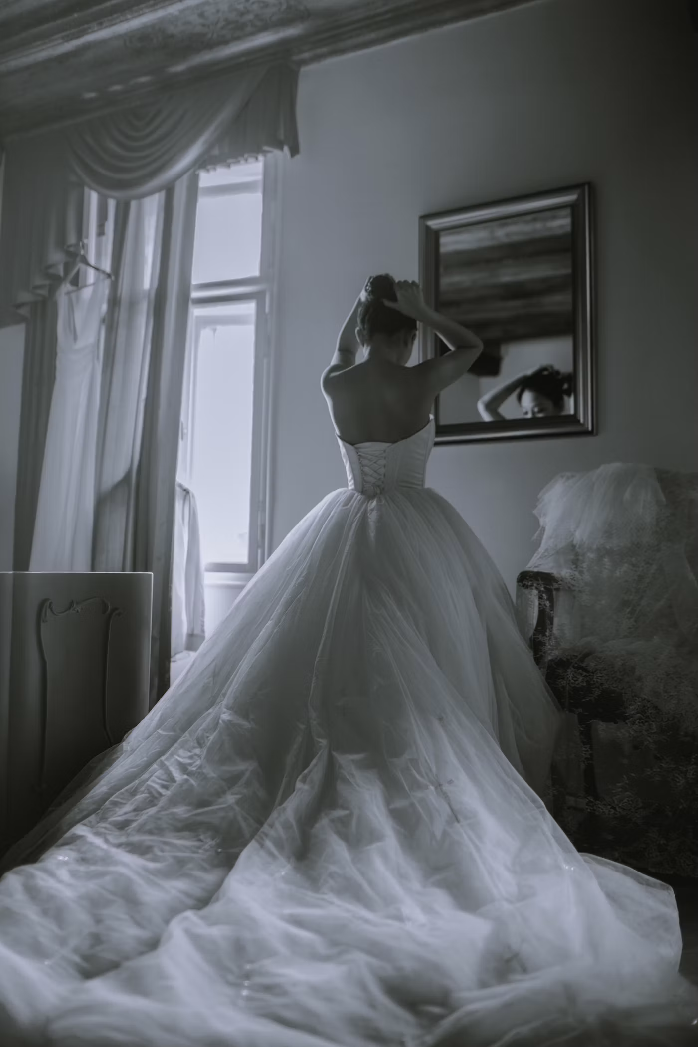 Bride preparing in front of a mirror